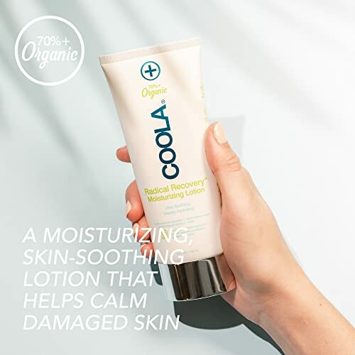Hand holding Coola Radical Recovery Moisturizing Lotion
