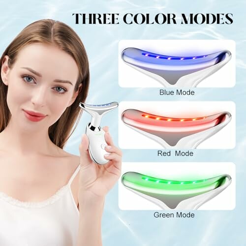 Woman holding a facial massager with three color modes: blue, red, and green.