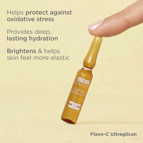 Hand holding ISDIN Flavo-C Ultraglican ampoule with text on benefits.