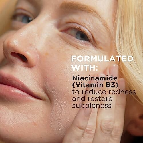 Close-up of person applying skincare with niacinamide benefits.
